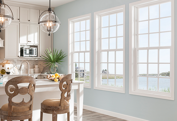 Inside of a Blue Kitchen Looking Out Onto Lake with Vinyl Replacement Windows in Smyrna, GA