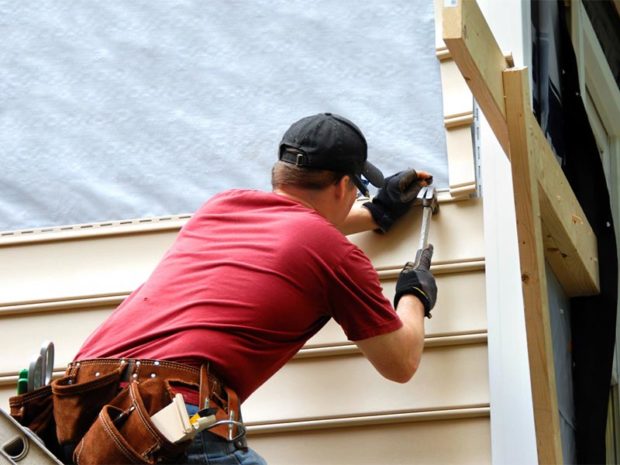 Man installing Cedar Shake Siding in Atlanta 