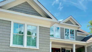 Gray siding on two-story home with white trim