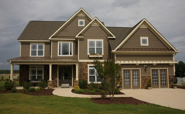 Brown Two Story House with Siding Replacement in Sandy Springs, GA