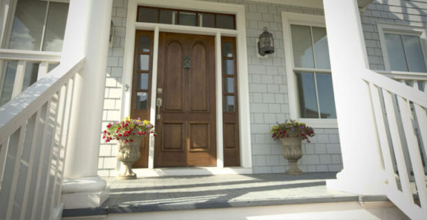 Home with Front Porch and Wood Door with Siding Replacement in Dunwoody, GA