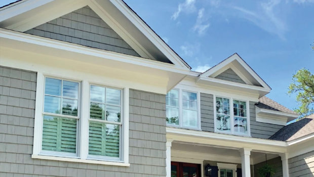 House with grey Siding and a vinyl Replacement Windows in Atlanta, Marietta, Alpharetta, Acworth, Kennesaw, Smyrna, and Surrounding Areas