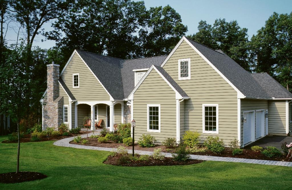 Front of Green House with Grass with Siding Replacement and Siding Installation in Atlanta